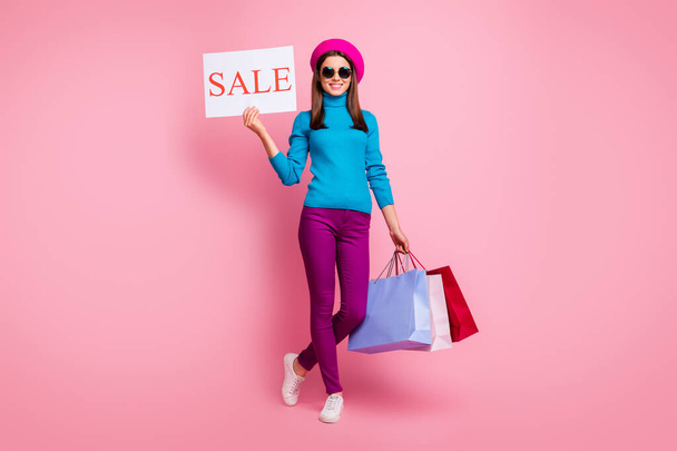 Full length body size view of her she nice attractive fashionable cheerful cheery girl holding in hands bags promo advert board store opening isolated over pink pastel color background - Фото, зображення