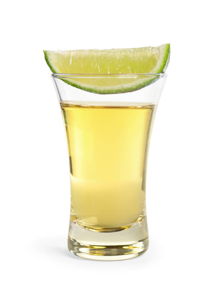 Mexican Tequila shot with lime slice isolated on white - Фото, изображение