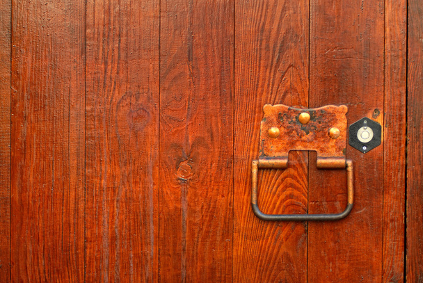 Handle on the wooden door - 写真・画像