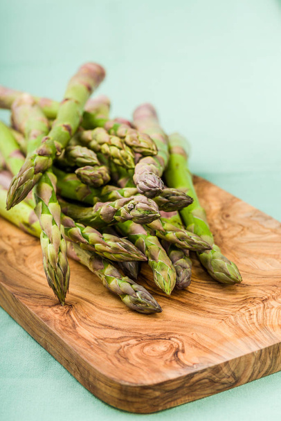 fresh green asparagus in a bunch and lots on a background - Fotó, kép