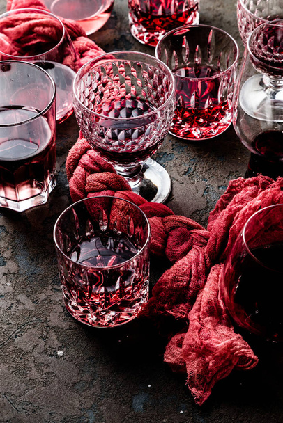 close-up view of red wine in glasses on grey background - Photo, image