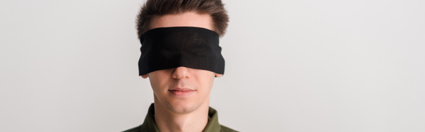 panoramic shot of blindfolded man isolated on white, human rights concept  - Photo, Image