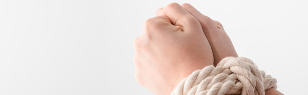 панорамный снимок женщины со связанными руками, изолированными на белом, концепции прав человека
  - Фото, изображение