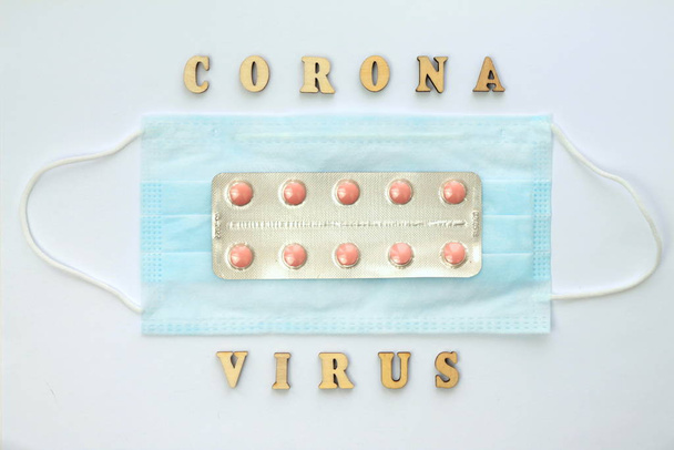 Word coronovirus in wooden letters. Global healthcare concept pandemic virus infection from Wuhan, China. Novel Coronavirus outbreak - Foto, Bild