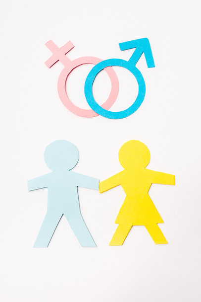 top view of paper cut people near gender signs isolated on white, sexual equality concept  - Photo, Image