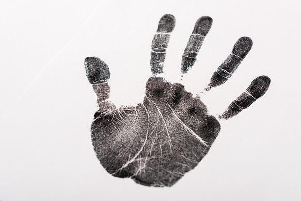 top view of black print of hand isolated on white, human rights concept  - Zdjęcie, obraz