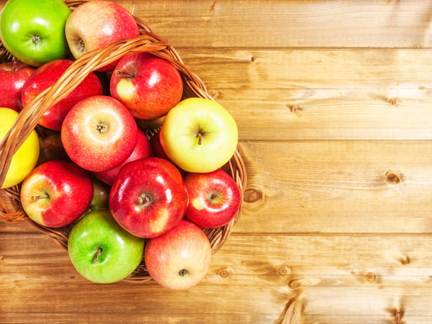 Basket of apple fruits on wooden background. Healthy eating and dieting concept. Copy space. Top view. Flat lay. - Foto, Bild