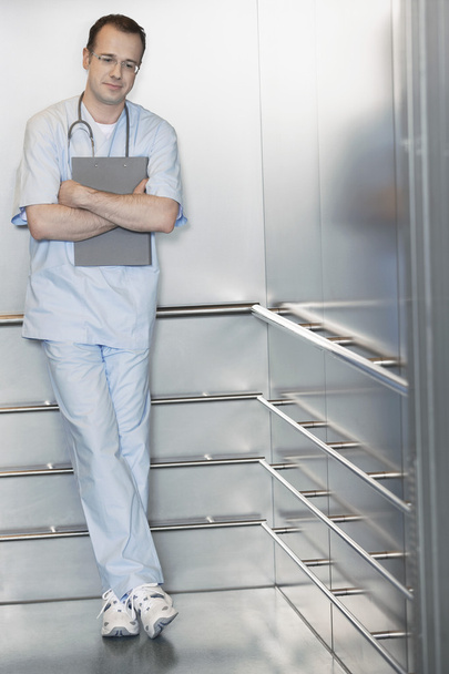 Physician Waiting in Elevator - 写真・画像