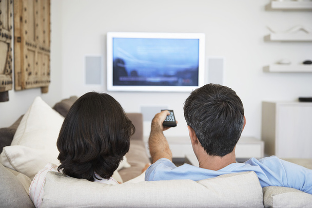 Couple using remote control - Zdjęcie, obraz