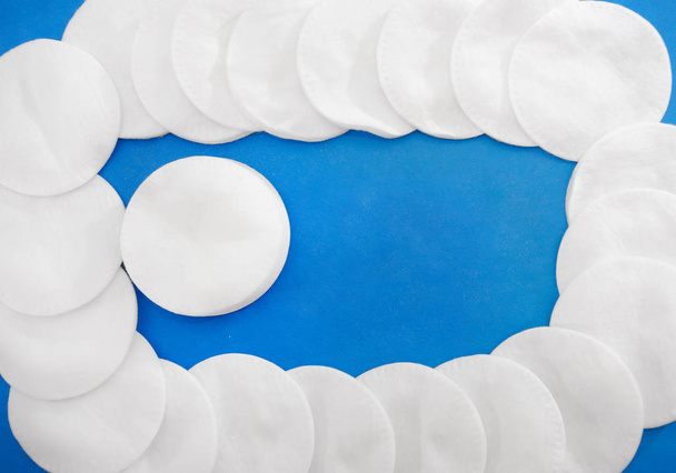 Cotton pads on a blue background. Close-up. - Photo, Image