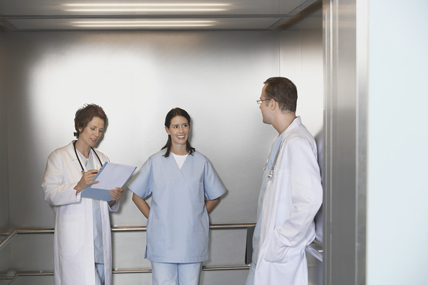 Physicians in Elevator talking - Fotografie, Obrázek
