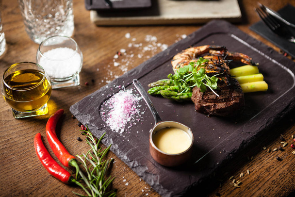Tasting menu. Beef steak and grilled tiger prawns. - Photo, image