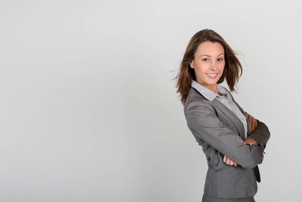 Beautiful businesswoman standing on white background - Fotó, kép
