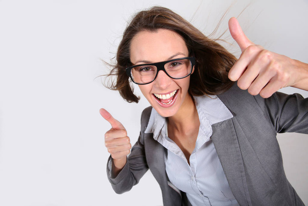 Businesswoman showing thumbs up - 写真・画像