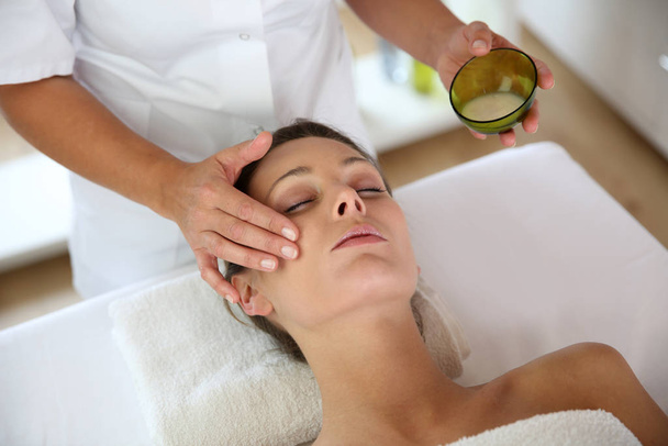 Woman receiving a face massage - Fotó, kép