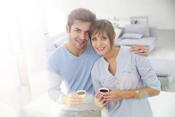 Happy young couple moving together in new apartment - Photo, Image