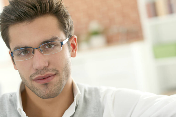 Portrait of handsome young man with eyeglasses on - Foto, Imagem