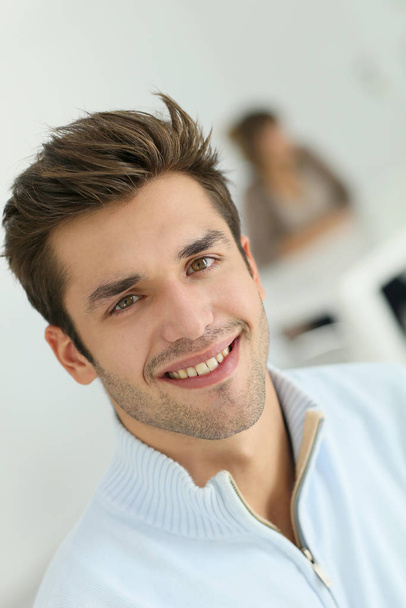 Portrait of young smiling man - Fotó, kép