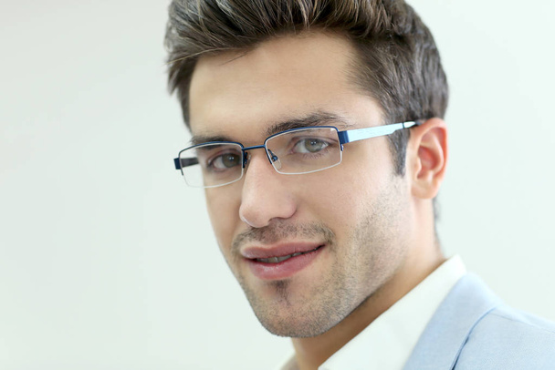 Portrait of young man wearing eyeglasses, isolated - Photo, Image