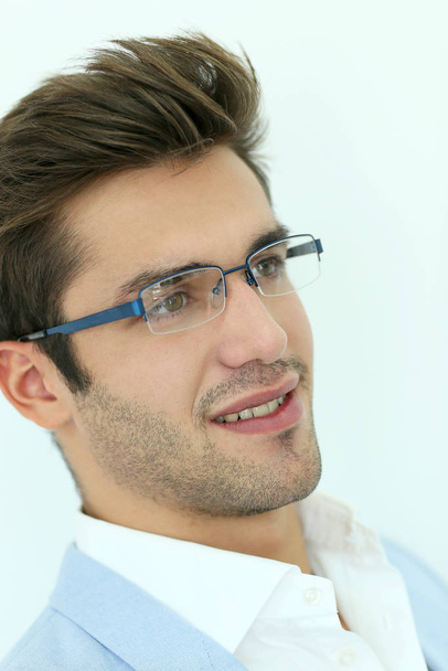 Portrait of young man wearing eyeglasses, isolated - Foto, Imagem