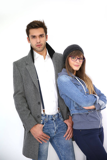 Trendy couple standing on white background - Foto, Imagem