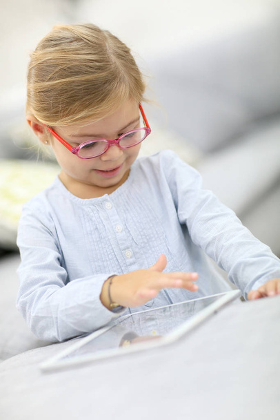 Cute little girl playing with digital tablet - Photo, Image