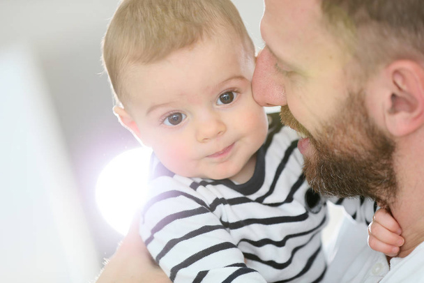 Portrait of daddy embracing baby boy - Valokuva, kuva