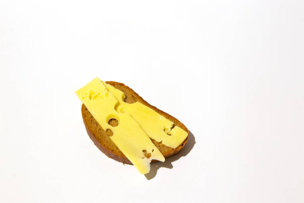 brown bread with cheese on a white background - Photo, Image