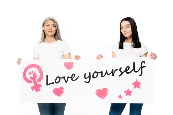 multicultural women holding poster with love yourself lettering isolated on white  - Photo, Image