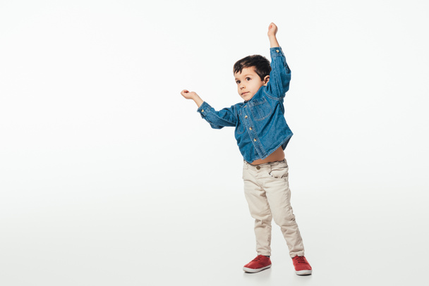cute boy in denim shirt showing yes gesture on white background  - Photo, Image