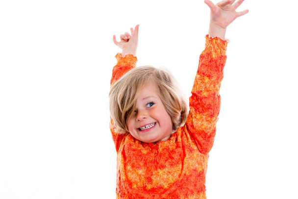 happy girl with arms up in front of white background - Foto, Imagen