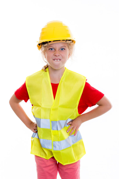 blond girl with reflective vest and helmet in front of white background - Фото, зображення