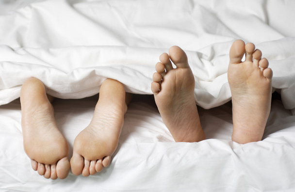 Couple lying in bed - Valokuva, kuva
