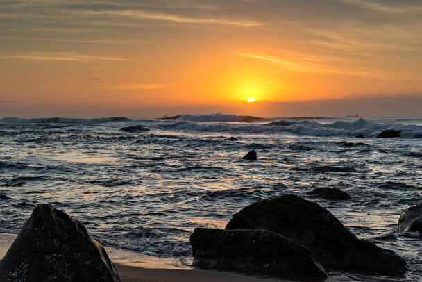 View of ships on the Indian Ocean from Umhlanga Rocks Beach at Sunrise - Foto, immagini