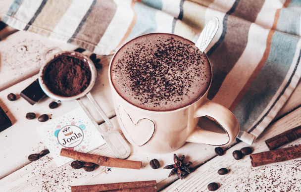 Two cups of hot cocoa with marshmallows and cinnamon sticks on wooden background. Love. Cocoa drink. Valentines day treat ideas. - 写真・画像