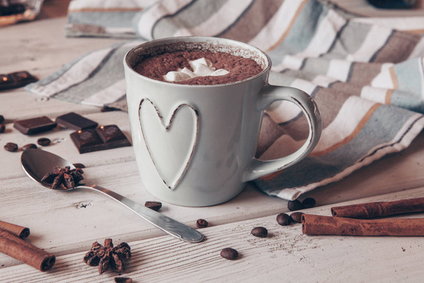 Two cups of hot cocoa with marshmallows and cinnamon sticks on wooden background. Love. Cocoa drink. Valentines day treat ideas. - Photo, Image