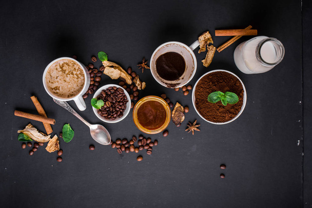 Mushroom Chaga Coffee Superfood Trend-dry and fresh mushrooms and coffee beans on dark background with mint. Coffee break - Photo, Image