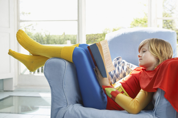 Boy  reading in armchair - Foto, Imagem