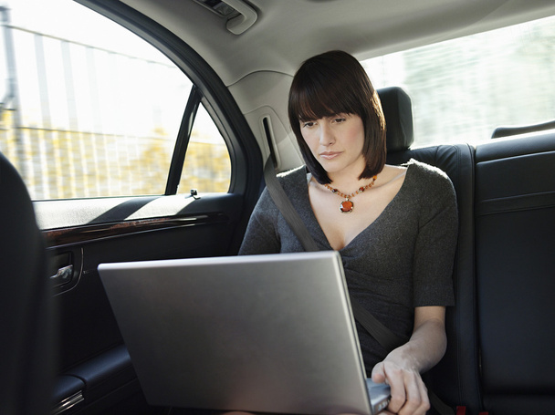 Mid adult woman using laptop - Zdjęcie, obraz