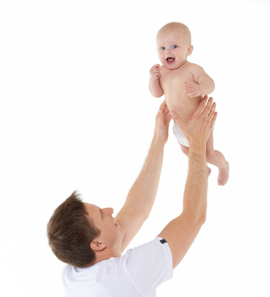 Young father and little baby boy are playing on a white background. Happy family. Six month - Foto, Bild