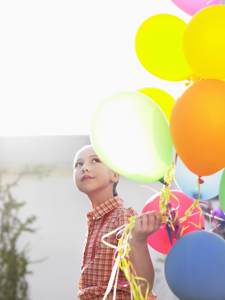 Girl with balloons smiling - Photo, image