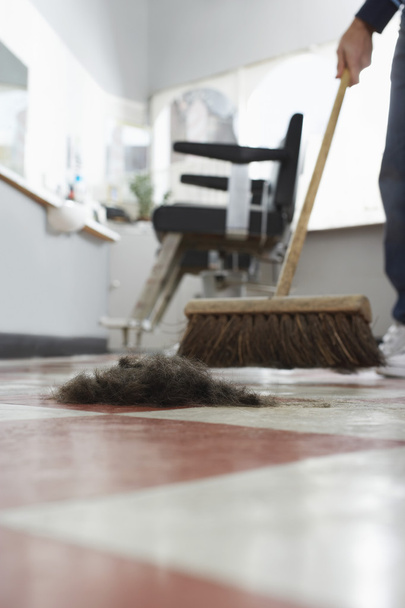 Barber sweeping floor - Fotó, kép