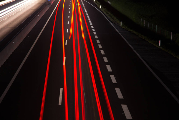 highway road at night, long term exposure - 写真・画像