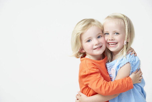 Two Pre School Girls Hugging One Another - Photo, Image
