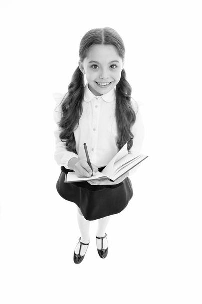 Writing essay. Girl with copy book or workbook. Kid perfect student ready with homework. School girl excellent pupil prepared essay or school project. Schoolgirl wear school uniform. Knowledge day - Foto, Imagem