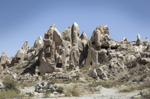 View of rock formations, Uchisar village, Cappadocia, Anatolia,Turkey - Фото, изображение