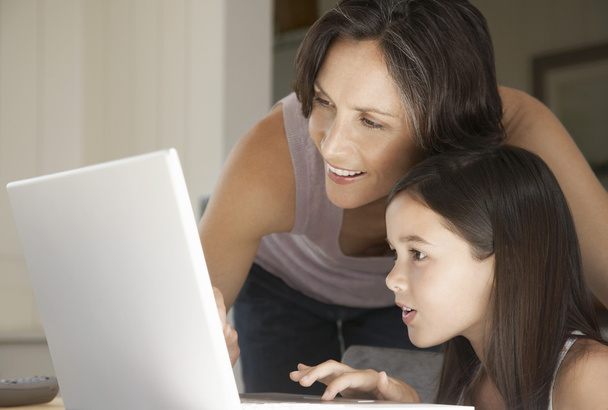 Mother and daughter with laptop - Foto, Bild