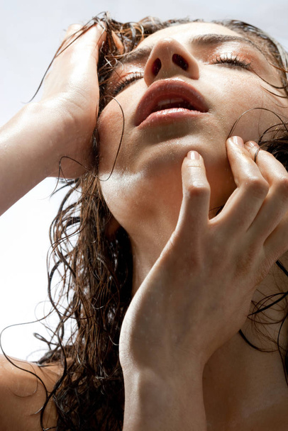 Portrait of young woman with wet hair - Zdjęcie, obraz
