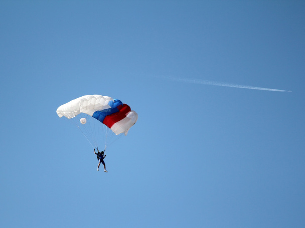 parachutist and airplane on blue sky - Photo, Image