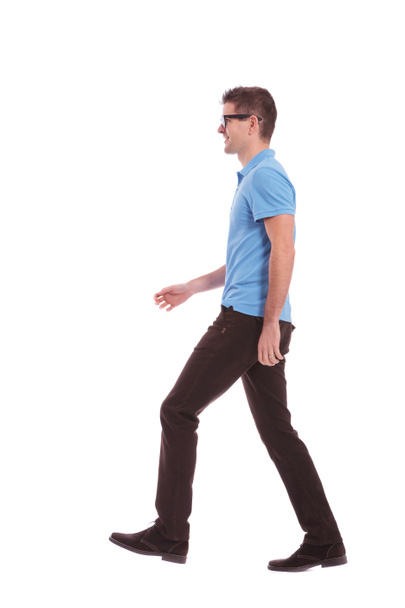profile of a casual man walking - Foto, afbeelding